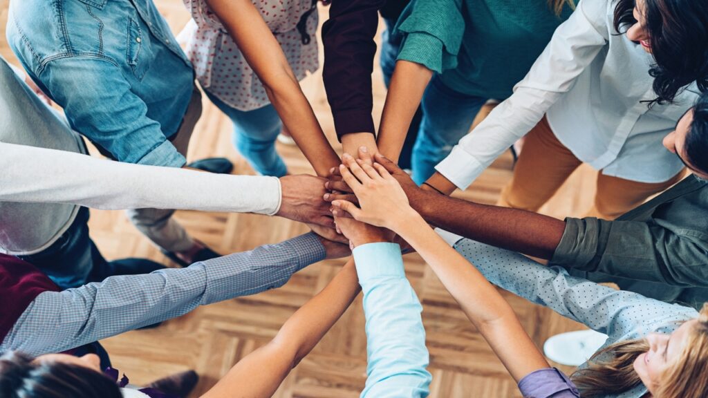 hands stretched together as a show of strength