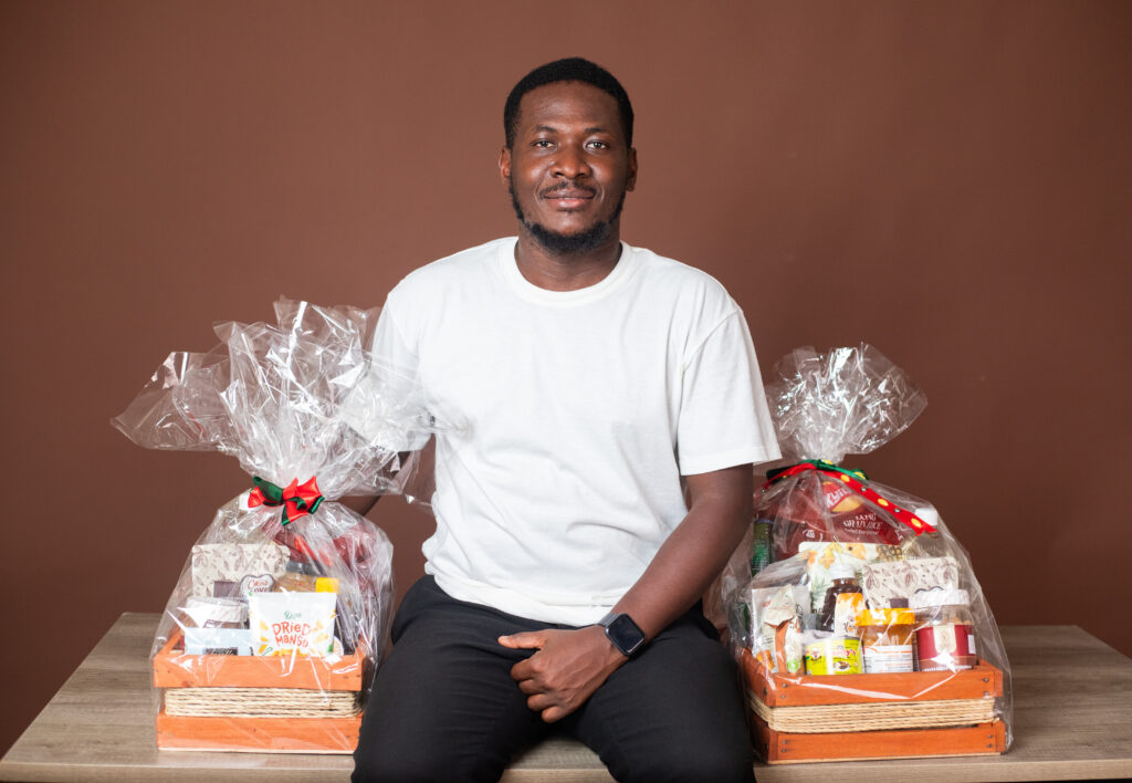 Sylvester poses with YUBEC Aseda Hampers